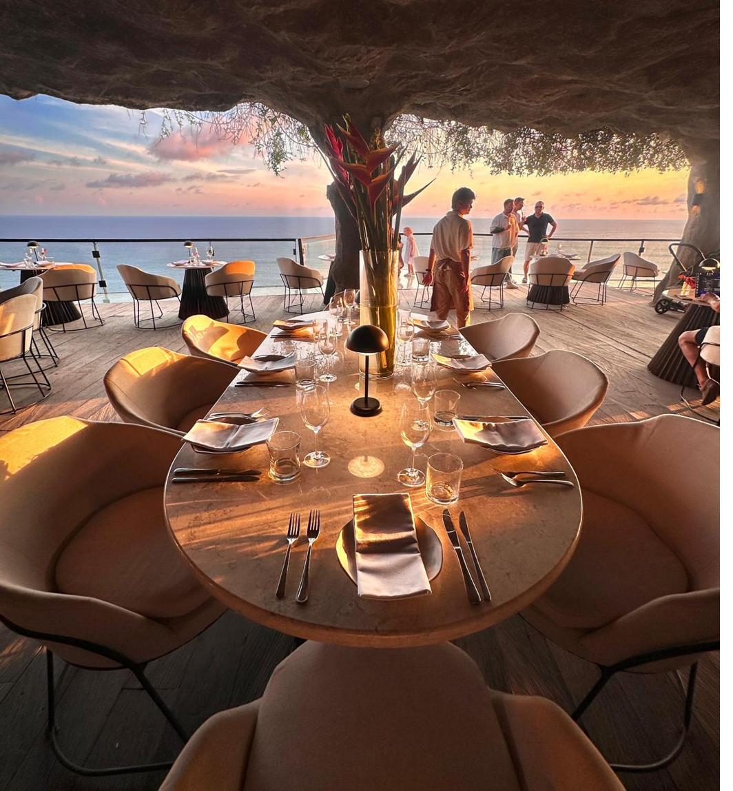 Rockfish Cliffside daytime dining with ocean view and sunset beginning