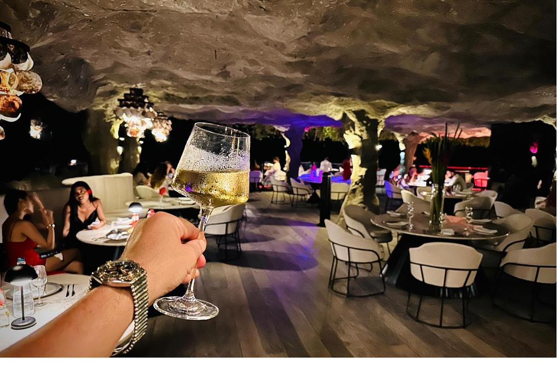 Rockfish Cliffside at night with purple uplights and candlelight