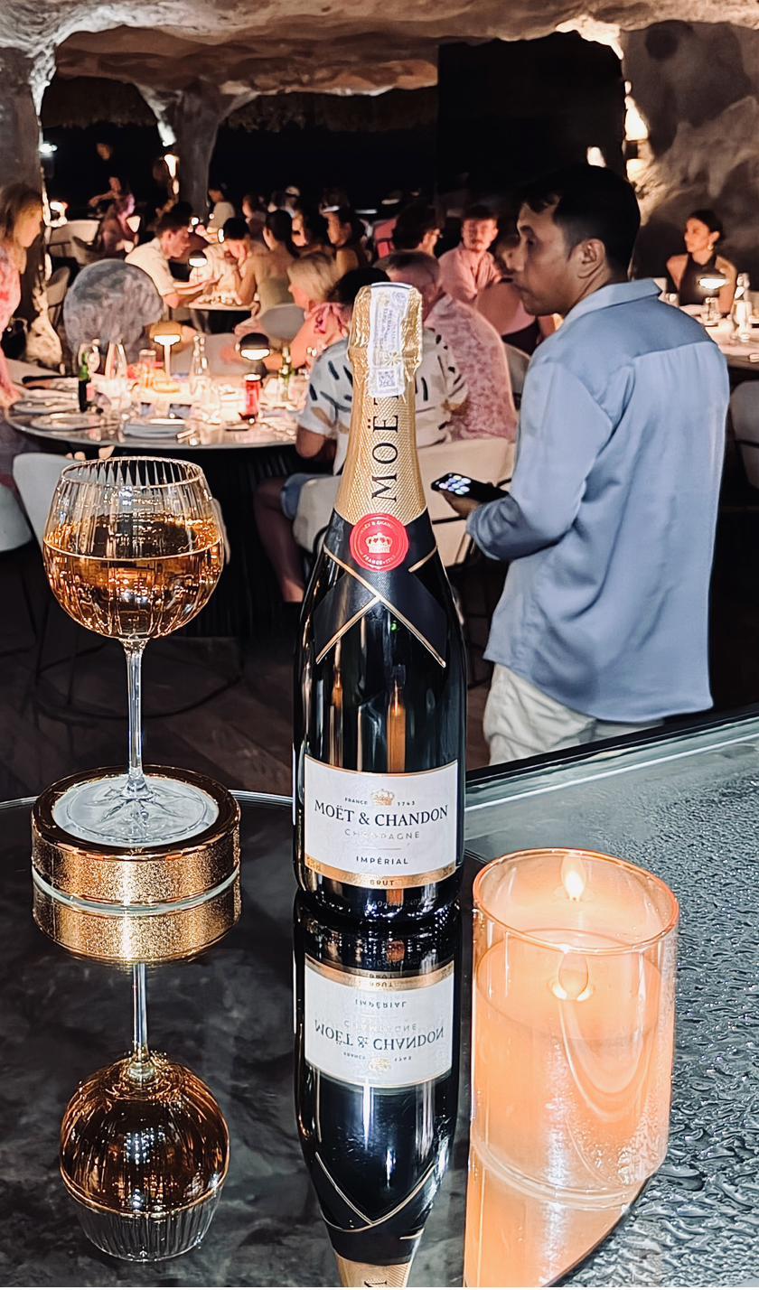 Champagne and candlelight at Rockfish Cliffside at night