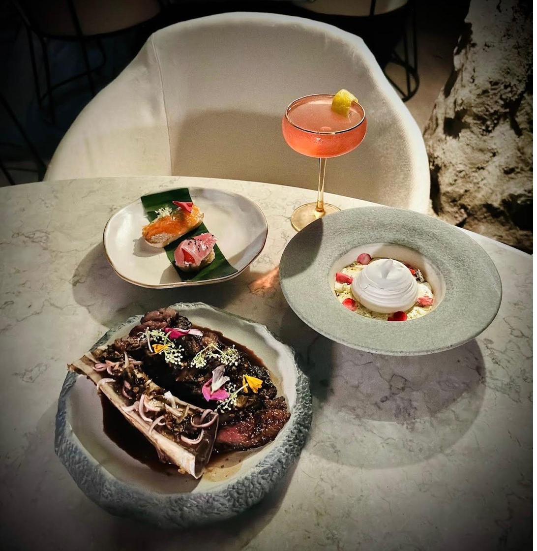 Wagyu, sashimi, pavlova dessert and signature cocktail at Rockfish Cliffside